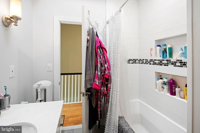 bathroom featuring shower / bath combo, vanity, and hardwood / wood-style flooring