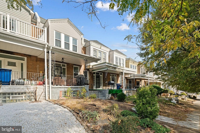 exterior space featuring a porch and a balcony