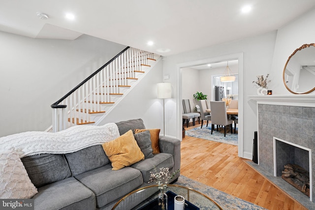 living room featuring a fireplace and hardwood / wood-style flooring