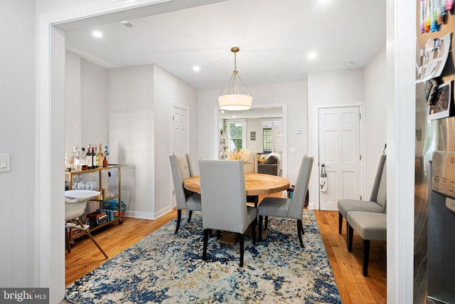 dining space featuring light hardwood / wood-style floors