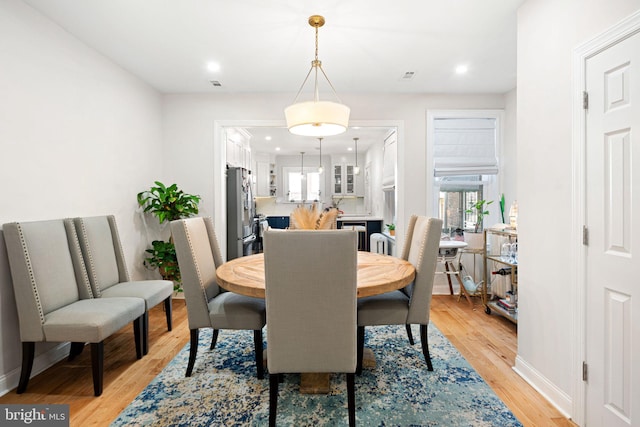 dining area with light wood-type flooring