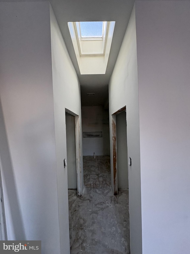 hallway with concrete floors