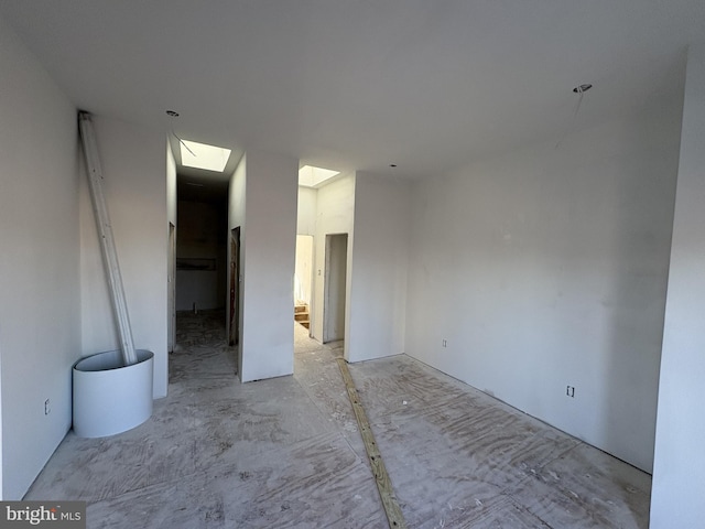 spare room featuring a skylight