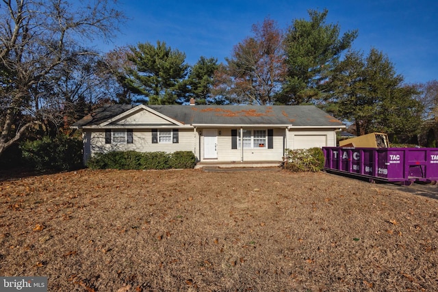 single story home featuring a garage