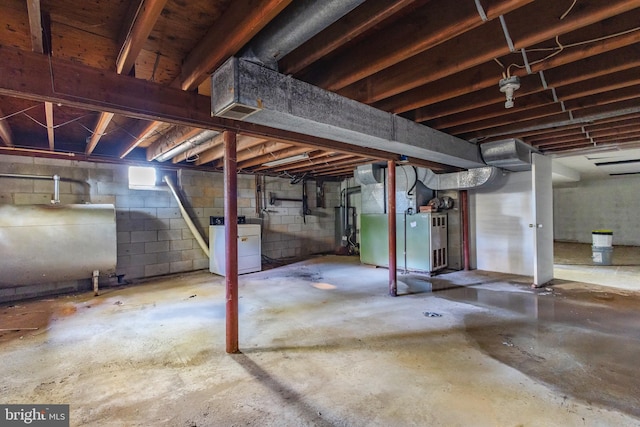 basement with washer / dryer and heating unit