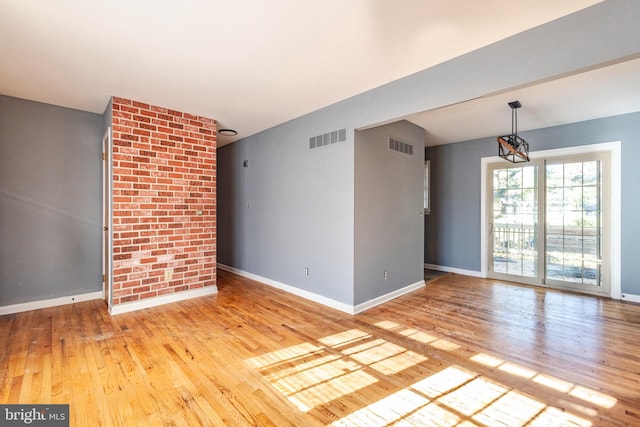 empty room featuring light hardwood / wood-style floors