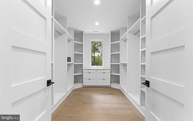 walk in closet featuring light wood-type flooring