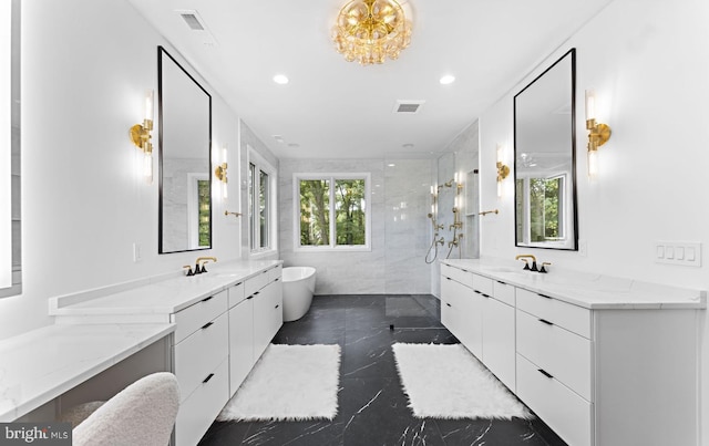 bathroom with vanity, separate shower and tub, and plenty of natural light