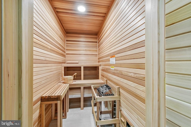 view of sauna / steam room featuring wood walls, tile patterned flooring, and wood ceiling