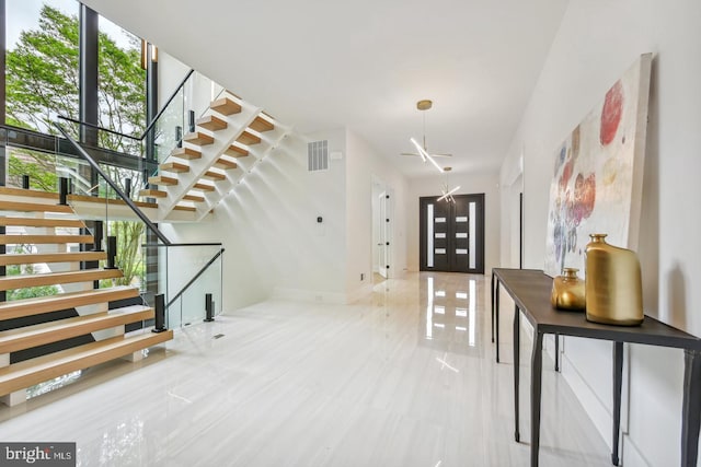 foyer featuring french doors and plenty of natural light