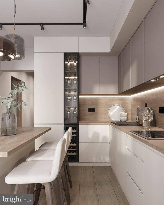 kitchen featuring pendant lighting, white cabinets, black electric stovetop, and light hardwood / wood-style flooring