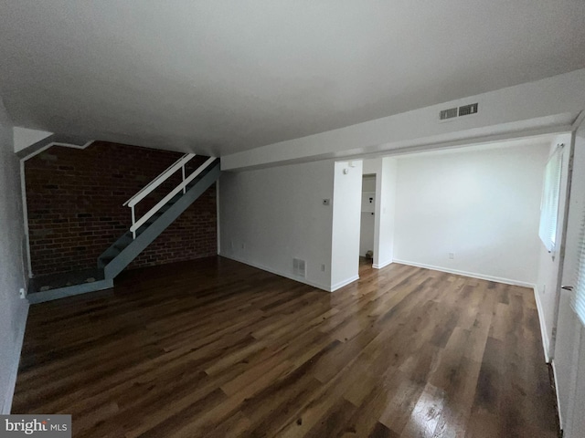 unfurnished living room with dark hardwood / wood-style floors