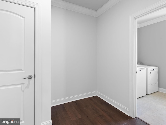 laundry room featuring independent washer and dryer, wood-type flooring, and crown molding