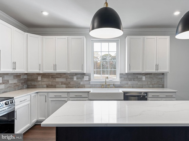 kitchen with light stone counters, dishwasher, sink, white cabinetry, and decorative light fixtures