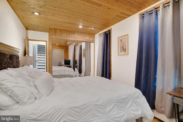 bedroom with a closet and wood ceiling