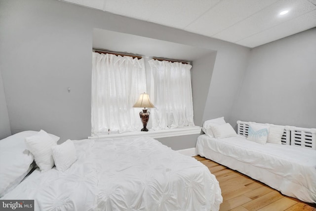 bedroom with hardwood / wood-style flooring