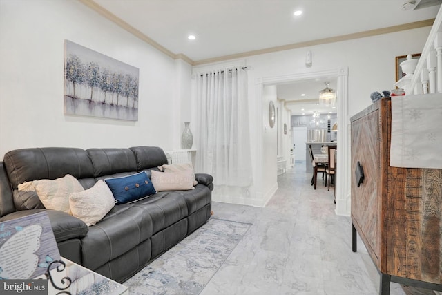 living room with a chandelier and crown molding