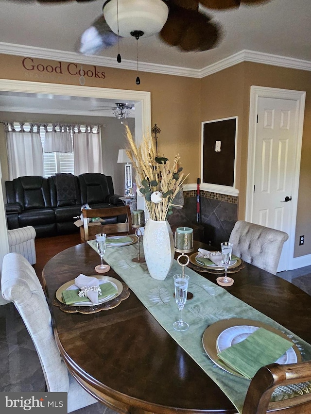 dining space featuring ornamental molding