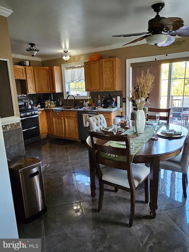 dining area with ceiling fan, sink, and ornamental molding