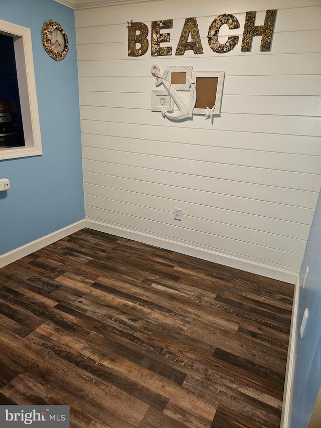 spare room with dark hardwood / wood-style floors