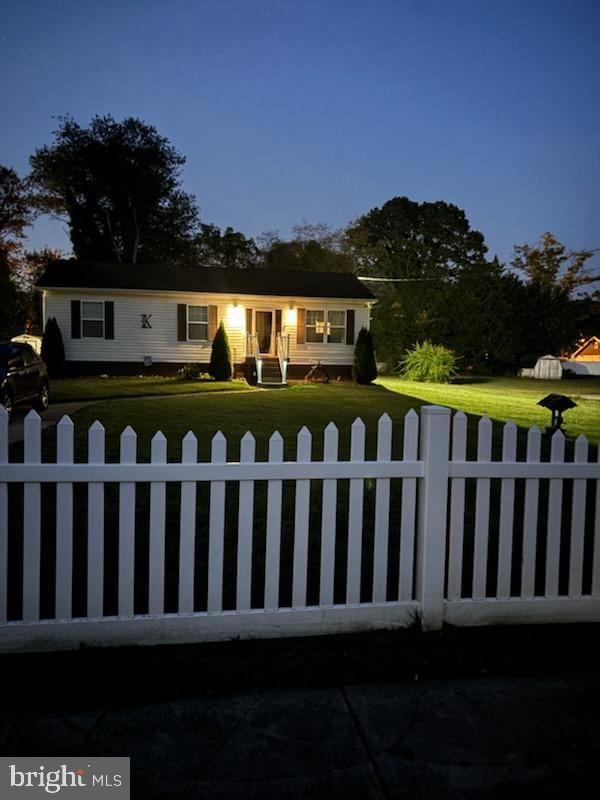 ranch-style house featuring a yard