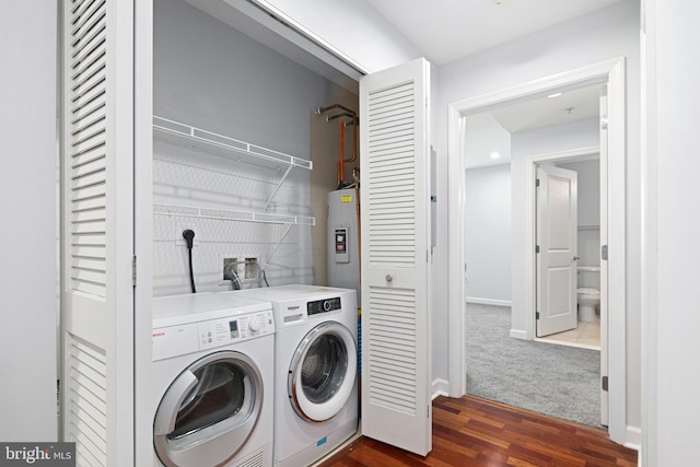 laundry room with dark hardwood / wood-style flooring and independent washer and dryer