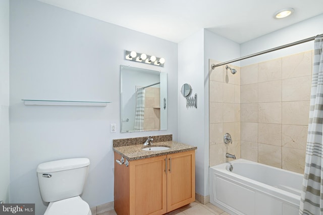 full bathroom featuring toilet, vanity, tile patterned floors, and shower / bath combo with shower curtain