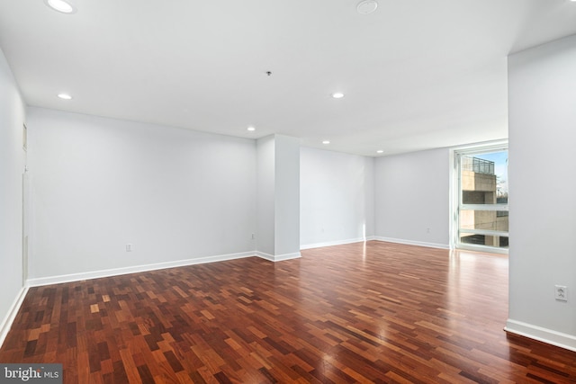 unfurnished room featuring dark hardwood / wood-style flooring