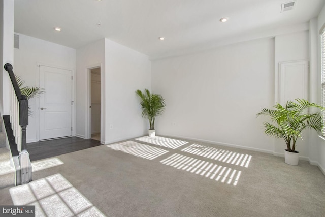 interior space with dark colored carpet