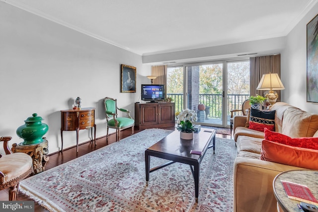 living room with ornamental molding and wood-type flooring