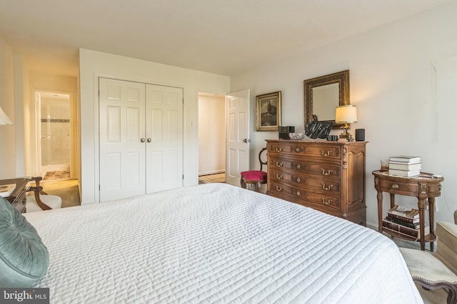 bedroom with a closet and ensuite bath