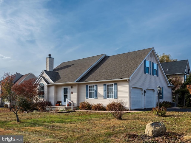 view of front facade featuring a front lawn and a garage