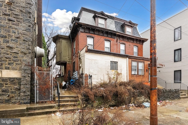 1612 N 54th St, Philadelphia, PA 19131 - back of house with mansard roof and brick siding