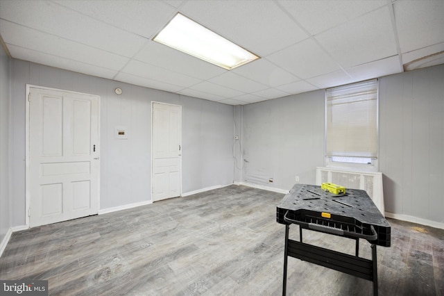 1612 N 54th St, Philadelphia, PA 19131 - basement with wood finished floors, a paneled ceiling, and baseboards