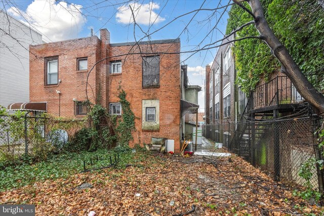 1612 N 54th St, Philadelphia, PA 19131 - rear view of house with brick siding and fence