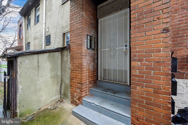 1612 N 54th St, Philadelphia, PA 19131 - doorway to property featuring brick siding