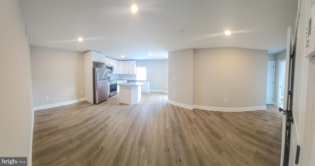 unfurnished living room featuring light hardwood / wood-style flooring