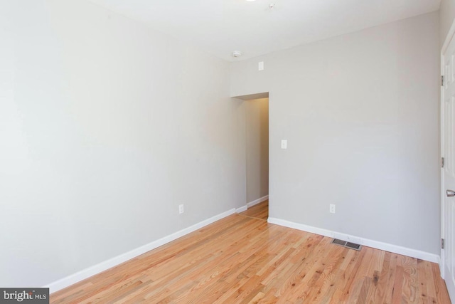 empty room with light hardwood / wood-style floors