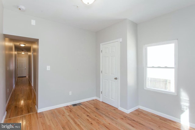 spare room featuring light hardwood / wood-style floors