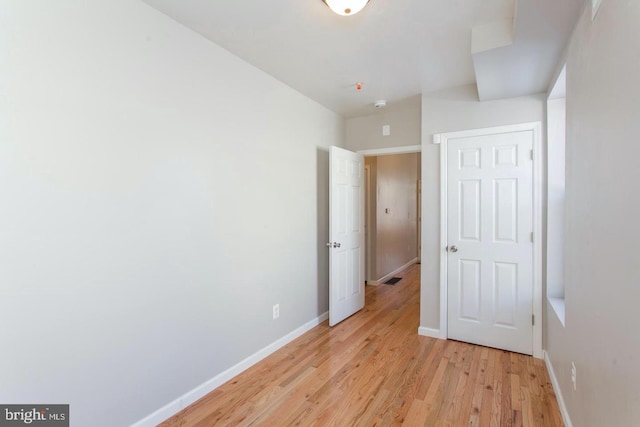 unfurnished bedroom with light hardwood / wood-style floors