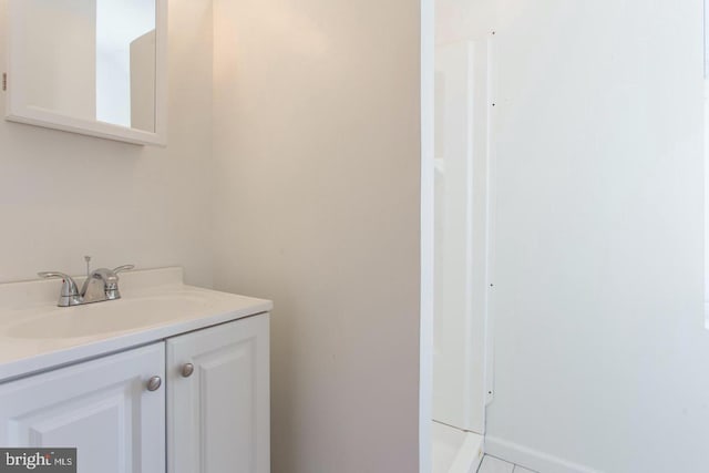 bathroom with vanity and tile patterned floors