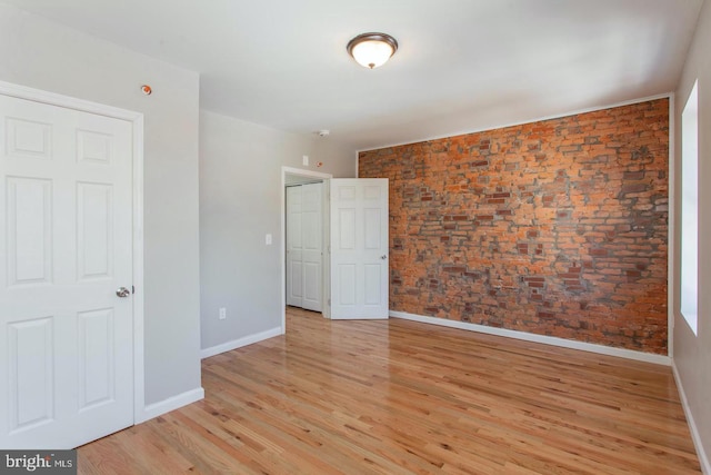 unfurnished room with light wood-type flooring