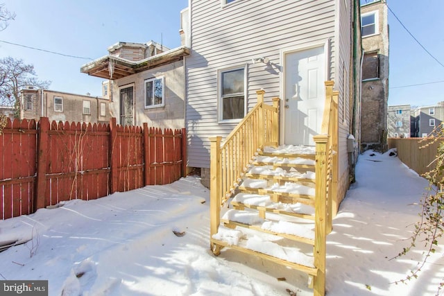 view of snow covered property entrance