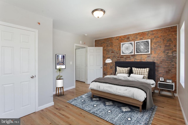 bedroom with hardwood / wood-style flooring