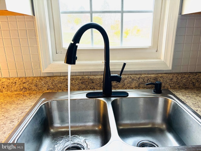 details with white cabinets and sink