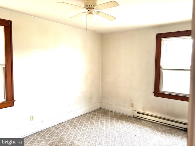 empty room with ceiling fan, light carpet, and a baseboard radiator