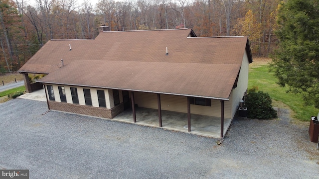 rear view of house with a carport