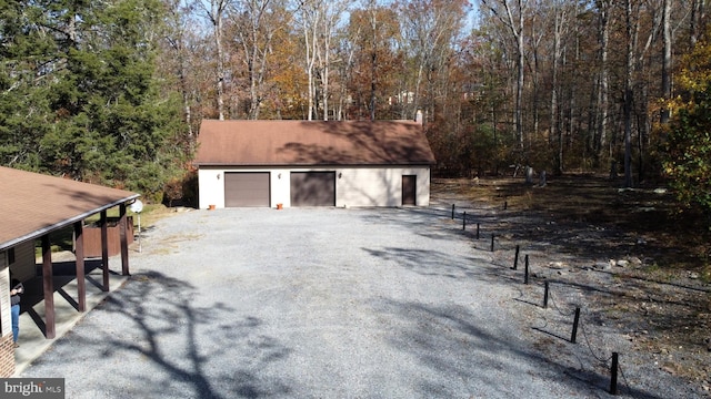 garage featuring a carport