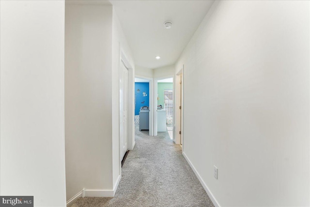 corridor with light colored carpet