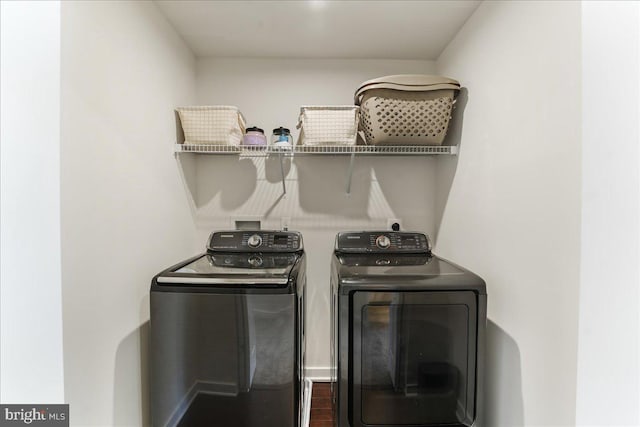 laundry room with washing machine and clothes dryer